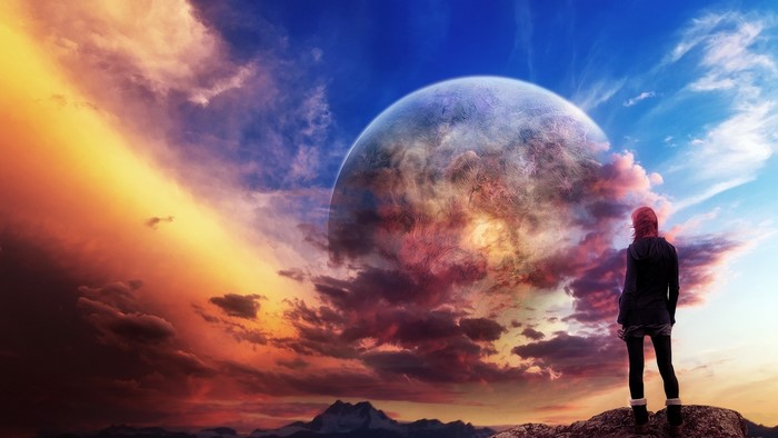 Woman looking at a planet in the sky