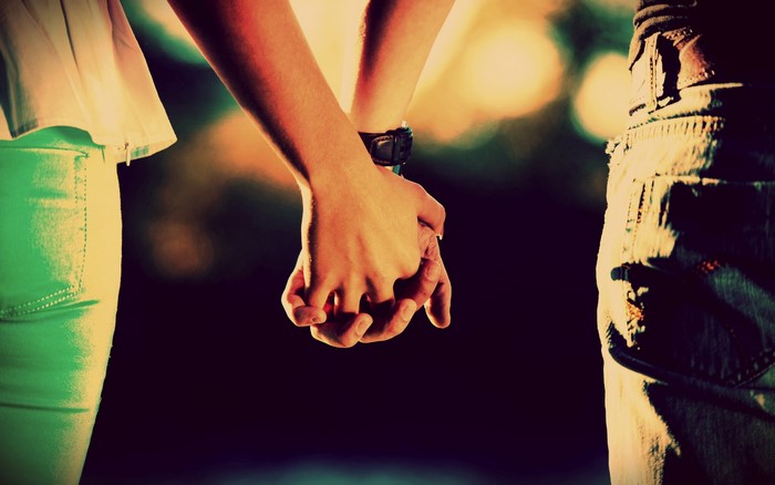 Couple holding hands
