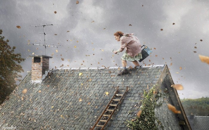 Woman on a windy rooftop during a storm