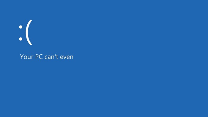Windows BSOD with sad face and text