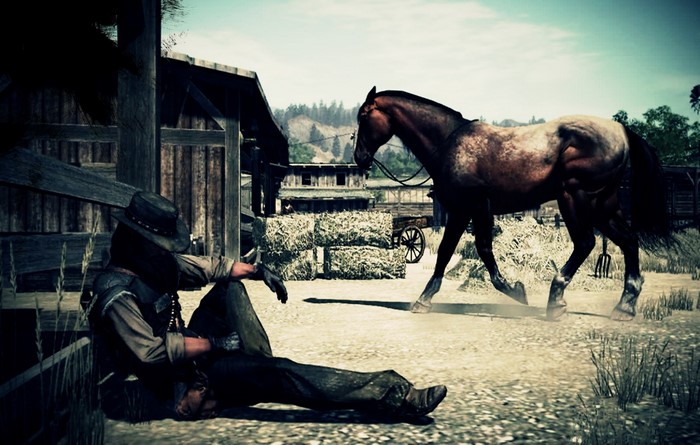 John Marston from Red Dead Redemption sitting by a barn with a horse