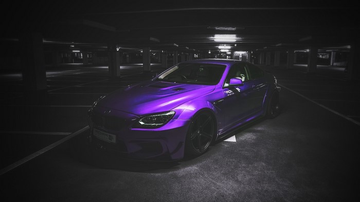 Purple BMW M6 in a parking garage
