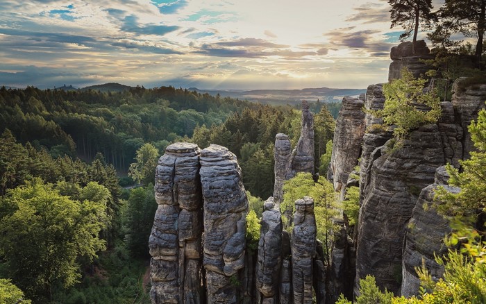 Sunset Over Rock Formations and Forest in Czech Republic