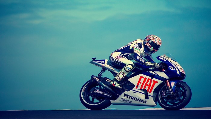 Valentino Rossi racing a Fiat Yamaha motorcycle