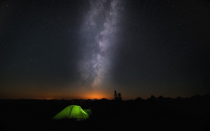 Starry Night Sky Over Glowing Tent