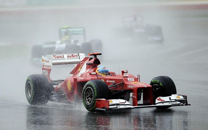 Ferrari Formula 1 car driven by Fernando Alonso in the rain