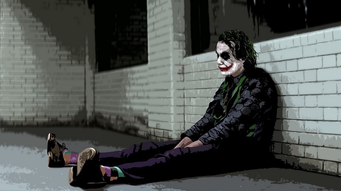 The Joker from The Dark Knight sitting in a hallway
