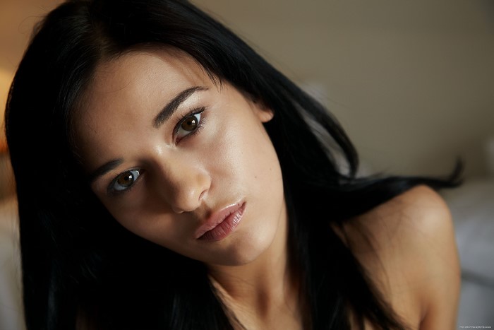 Kamila a woman with dark hair and brown eyes
