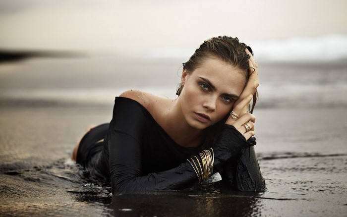 Cara Delevingne on a wet beach