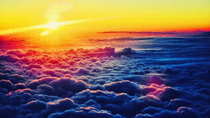 Sunset over clouds with sun and sky