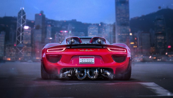 Red Porsche 918 Spyder with custom exhaust and city background