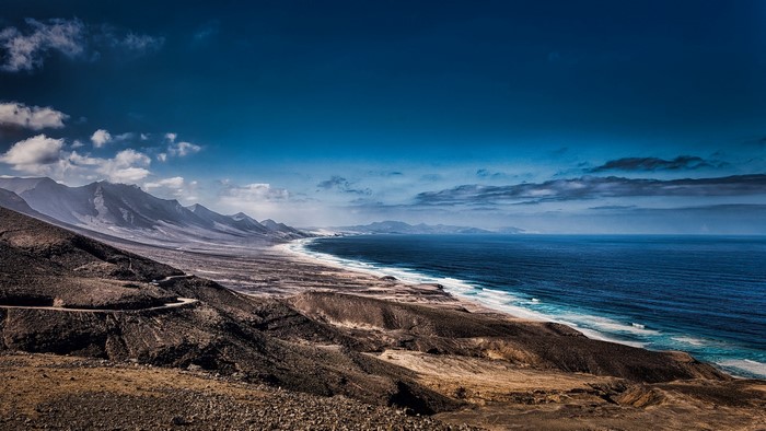 Mountainous coastline with a winding road and the sea