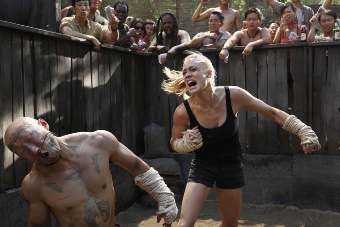 Yvonne Strahovski fighting in an arena with audience