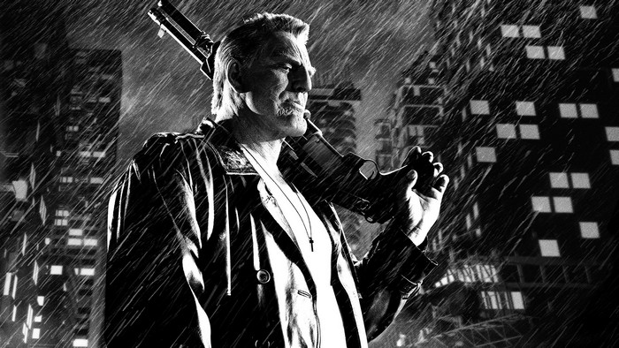Marv from Sin City holding a gun in the rain