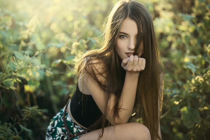 Woman with long brown hair outdoors