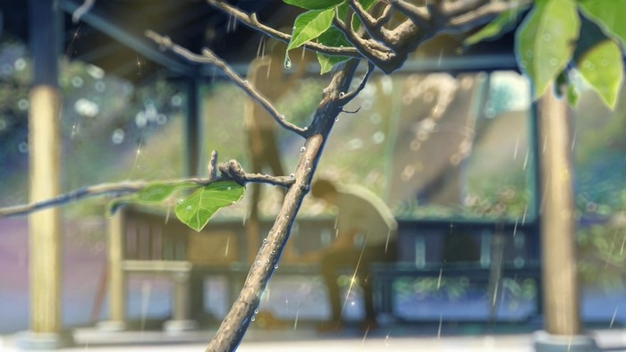 Rainy day at a bus stop with a tree branch
