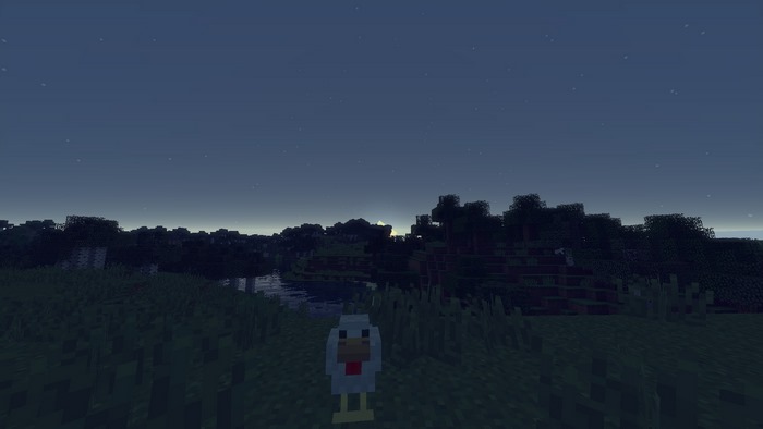 Minecraft chicken in a dark landscape with moon