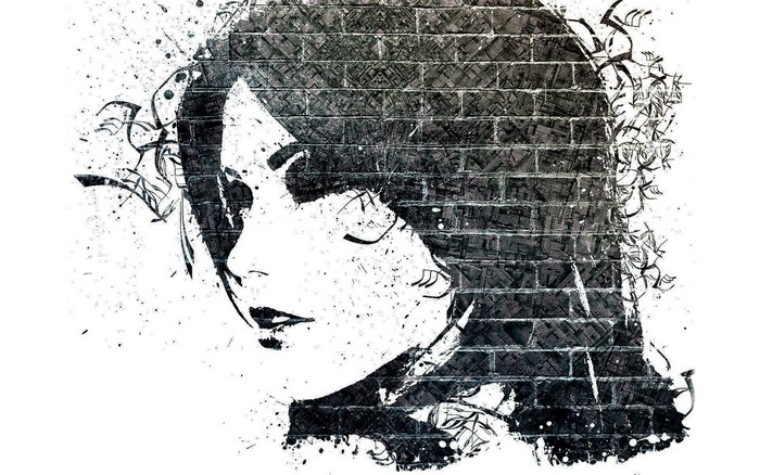 Graffiti artwork of a woman's face on bricks