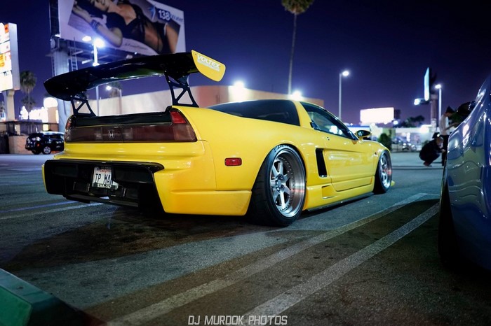 Yellow Honda NSX with large rear spoiler