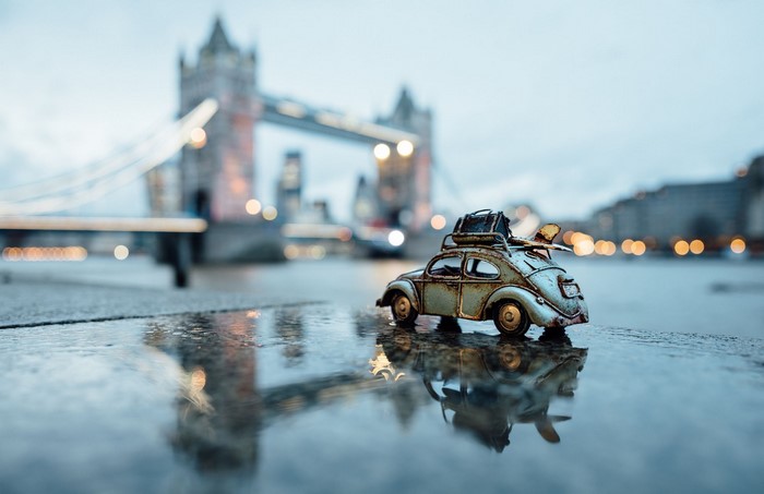 Toy car with luggage in front of Tower Bridge, London