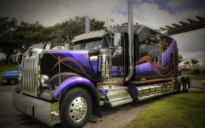Custom Kenworth Semi-Truck with Purple and Gold Flames