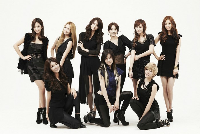 Girls' Generation members posing in black outfits