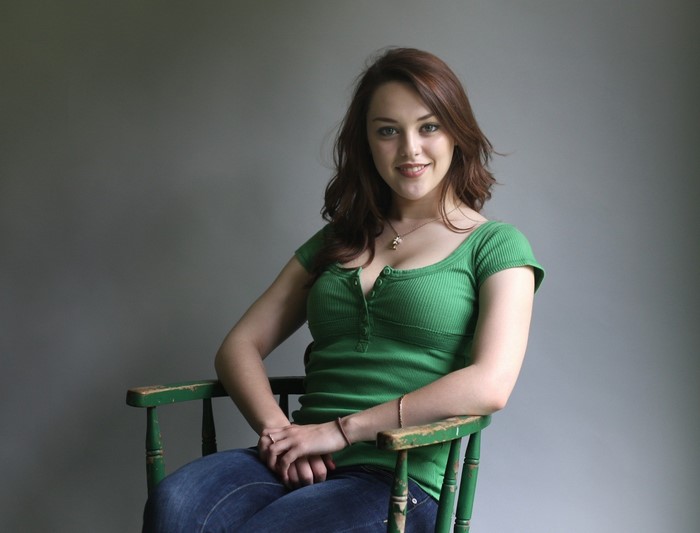 Imogen Dyer Sitting on a Green Chair