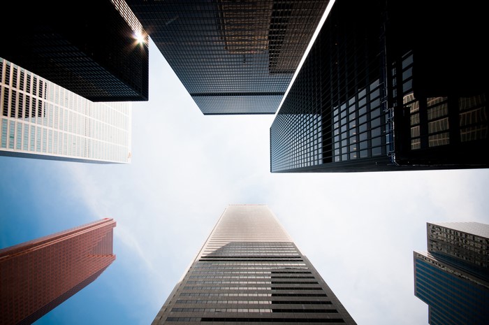 Skyscrapers viewed from below against a bright sky