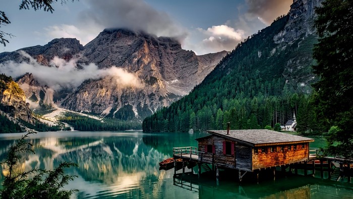 Lake and mountains with a boathouse in Italy
