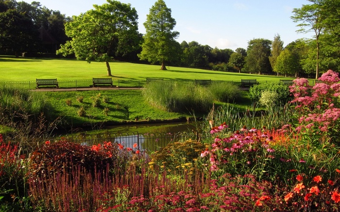 Park with pond and flower beds