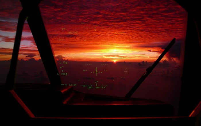 Aircraft cockpit HUD at sunset