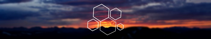 Hexagons overlaying a blurred sunset landscape