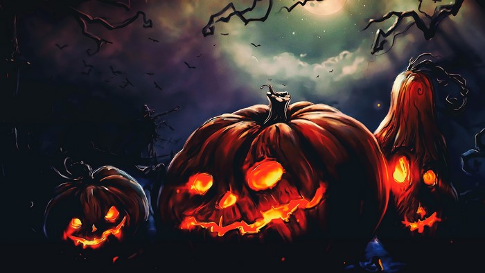 Halloween pumpkins in a spooky forest at night