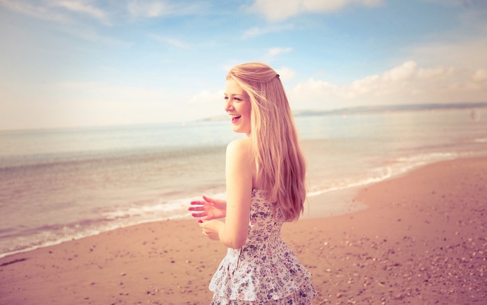 Woman with blonde hair on a beach