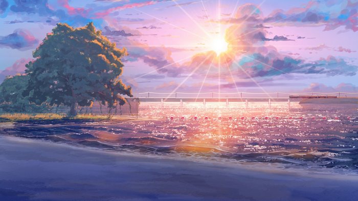 Beach pier at sunset with sun rays and clouds