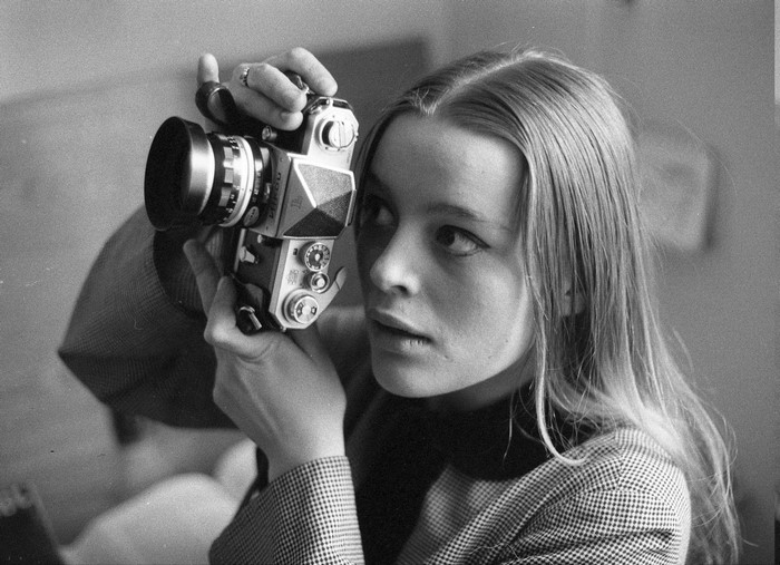 Actress Magda Vasaryova holding a Nikon camera