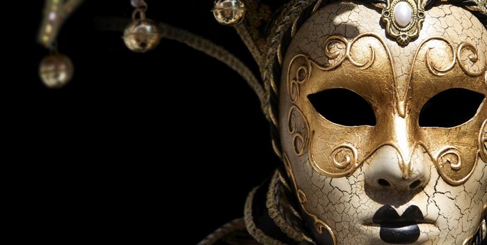 Venetian jester mask with bells on black background
