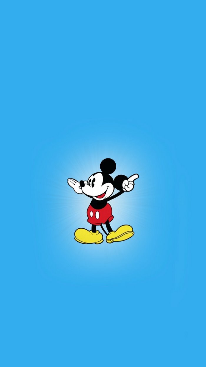 Mickey Mouse pointing with arms outstretched