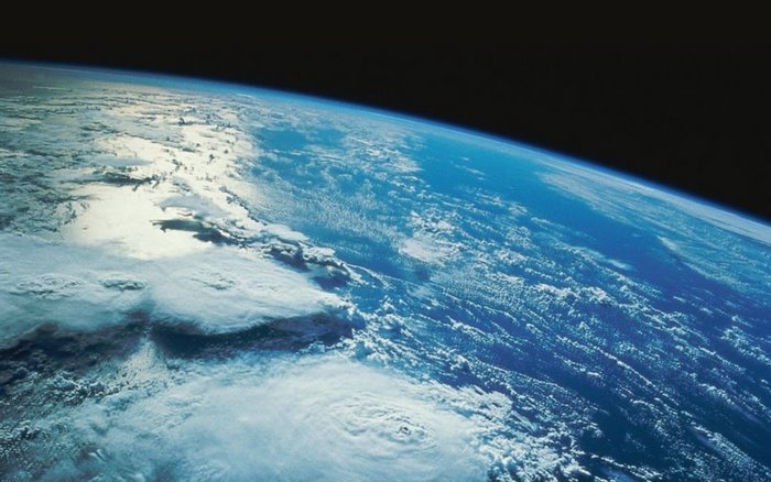 Earth from space with clouds and atmosphere