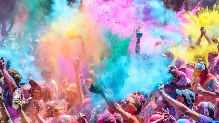 People celebrating Holi with colorful powder