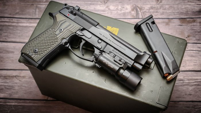 Beretta 92 pistol with magazine and light