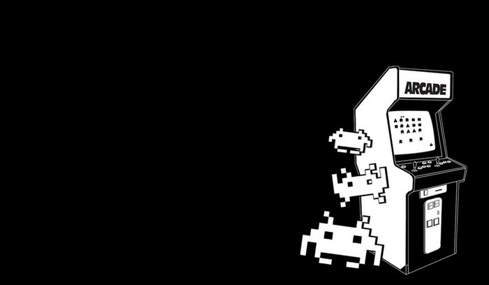 Retro arcade cabinet with pixelated aliens