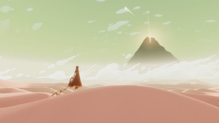 Journey video game character walking through desert towards mountain