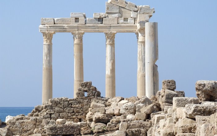 Ancient Greek ruins with columns and blue sky