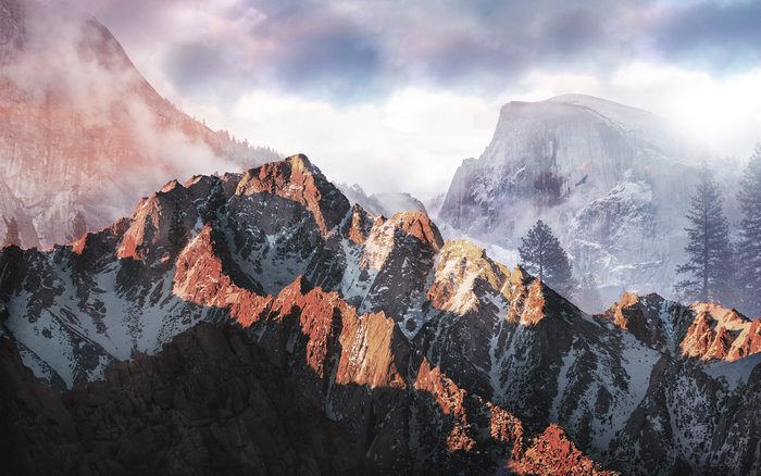 Sunset mountains with snow and forest