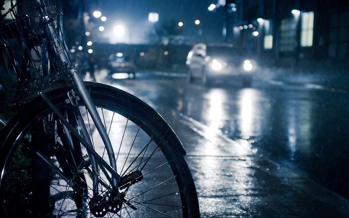 Bicycle on a Rainy City Street at Night