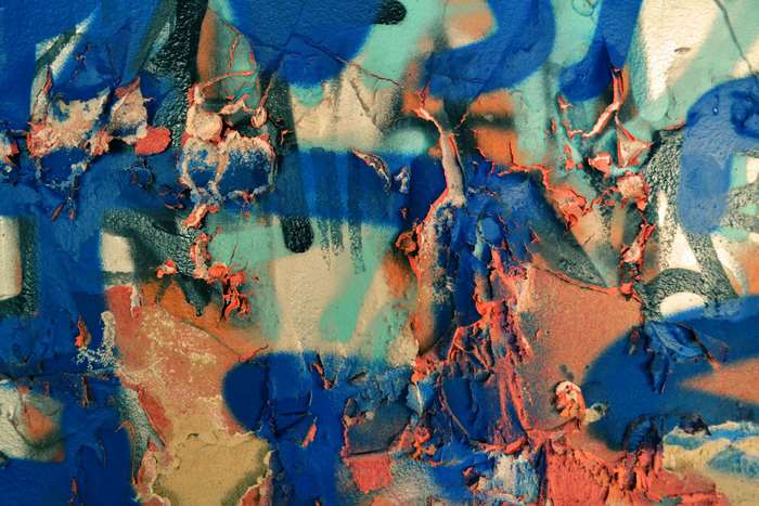 Graffiti art with peeling paint and textures