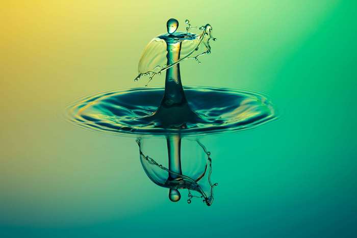 Water drop splash with reflection