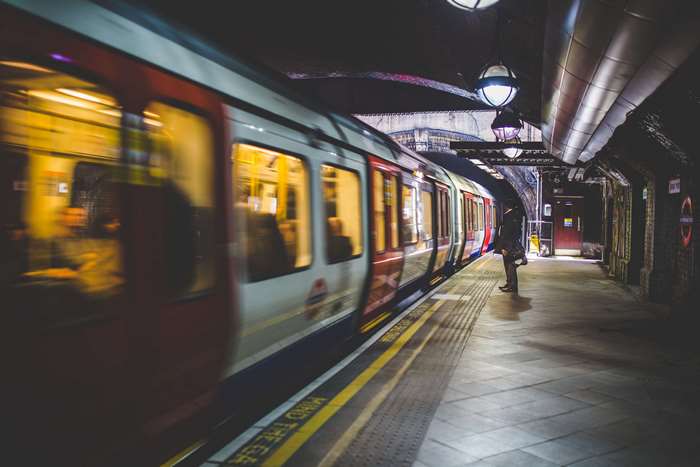 Train moving through a subway station