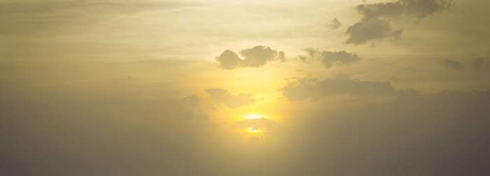 Sunset with soft yellow light and clouds 4K